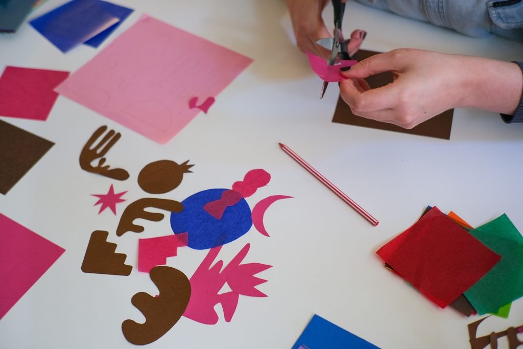 Cutting paper shapes with scissors